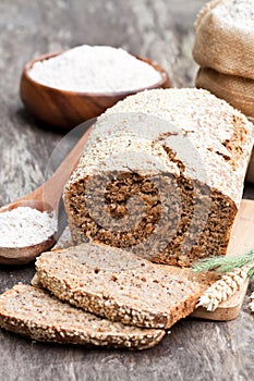 Homemade rye bread with wholemeal bread flour on wooden table