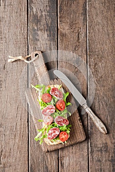 Homemade sandwich on old wooden background