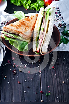 Homemade sandwich with salad and juice as a healthy breakfast