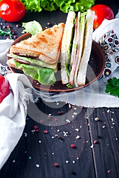 Homemade sandwich with salad and juice as a healthy breakfast