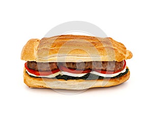 Homemade sandwich with sausage, chicory, mozzarella and tomato isolated on white background