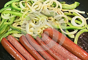 Homemade sausage and peppers in a skillet