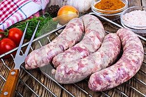 Homemade sausages in a natural shell with spices on grill