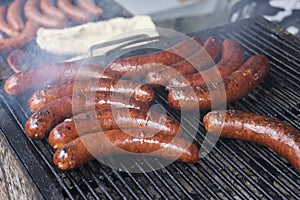 Homemade sausages roasted in barbecue and in oil