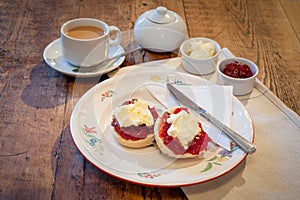Homemade scones with jam and clotted cream photo