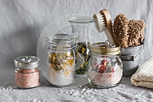 Homemade sea salt bath - calendula, pink himalayan, rose salt and bath accessories. Health, beauty, regeneration, skin cleansing c photo