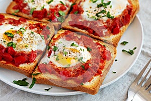 Homemade Sheet-Pan Shakshuka Toast on a Plate, side view. Close-up