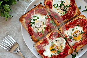 Homemade Sheet-Pan Shakshuka Toast on a Plate, top view. Close-up