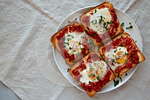 Homemade Sheet-Pan Shakshuka Toast on a Plate, top view. Copy space