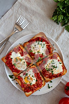 Homemade Sheet-Pan Shakshuka Toast on a Plate, top view. Flat lay, overhead, from above