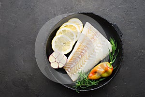 Homemade simple healthy. Farmer market vegetables white cod fish on a baking tray: zucchini, corn, purple onion, colored