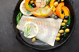 Homemade simple healthy. Farmer market vegetables white cod fish on a baking tray: zucchini, corn, purple onion, colored