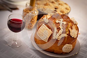 A homemade Slava cake decorated with religious symbol