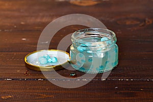 Homemade slime in a jar with various fillers: beads, blue balls