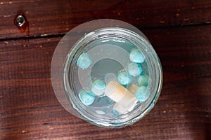 Homemade slime in a jar with various fillers: beads, blue balls