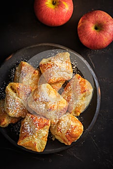 Homemade small apple turnovers in bowl