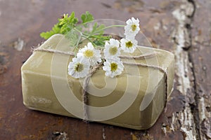 Homemade Soap with chamomille Flowers photo