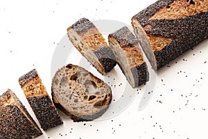 Homemade sourdough black bread baguette on white beackground. Food, baking