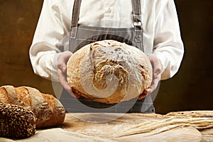 Homemade sourdough bread photography with man& x27;s hands. Recipe idea.