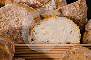 homemade sourdough bread in a wooden basket. Rustic style, selective focus