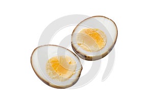 Homemade soy sauce egg half slice isolated on white