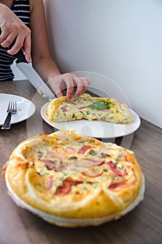 Homemade Spinach and Bacon Egg Quiche in a pie crust. French cuisine