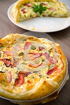 Homemade Spinach and Bacon Egg Quiche in a pie crust. French cuisine