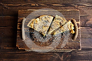 Homemade spinach french pie on a white wooden board