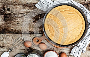 Homemade sponge cake or chiffon cake with ingredients on wooden table. Bakery background concept. banner, menu recipe place for