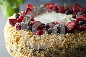 Homemade sponge cake with cream and fresh berries. Carrot and orange cake, decorated with berry. Close up sweet dessert. Whole