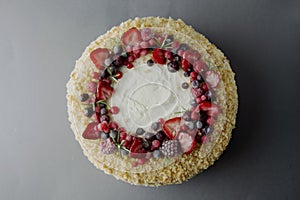 Homemade sponge cake with cream and fresh berries. Carrot and orange cake, decorated with berry. sweet dessert. Whole deliciouse