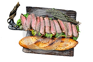 Homemade Steak sandwich with sliced roast beef, arugula and cheese. Isolated on white background, Top view.