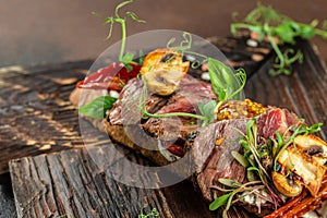 Homemade Steak sandwich with sliced roast beef on a wooden board. banner, menu, recipe copy space, top view