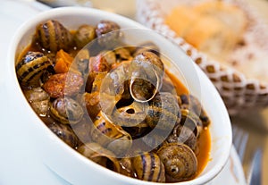 Homemade stewed escargots with chorizo