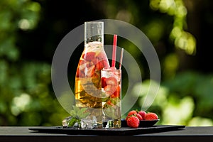 Homemade strawberry ice tea in the garden