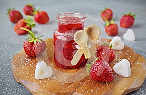 Homemade strawberry jam or marmalade in the glass jar photo