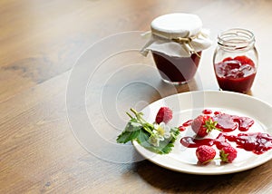 Homemade strawberry jam (marmelade) in jars photo