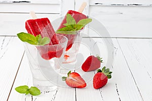 Homemade strawberry mint - ice pops - popsicles - paletas. photo