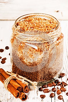 Homemade sugar scrub with coffee on a wooden background