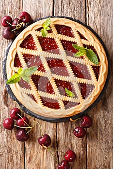 Homemade summer pastries cherry pie Crostata close-up. Vertical photo