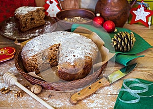 Homemade sweet cake with honey and walnuts with Christmas decorations