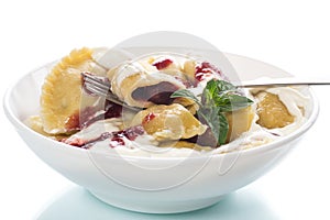 Homemade sweet dumplings with berries and sour cream