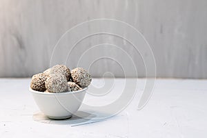 Homemade sweets energy balls made from superfoods like seeds, nuts and dried fruits.