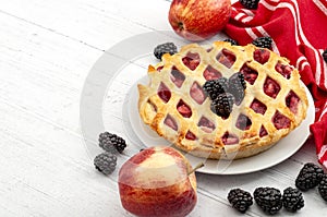 Homemade sweets, indulgence and fruity cakes concept with freshly baked tasty warm apple and blackberry pie, raw apples, fresh