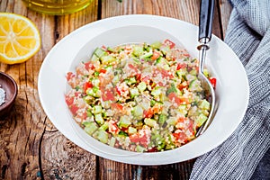 Homemade tabbouleh salad with quinoa and vegetables