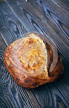 Homemade tartine bread on dark wooden table