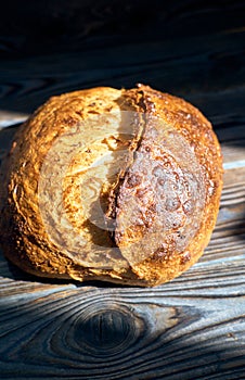 Homemade tartine bread on dark wooden table