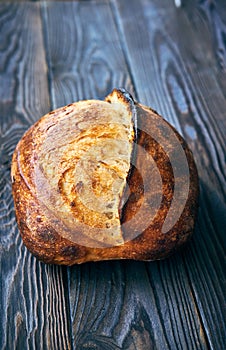 Homemade tartine bread on dark wooden table