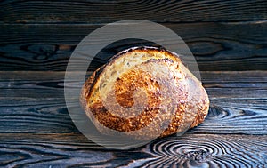 Homemade tartine bread on dark wooden table