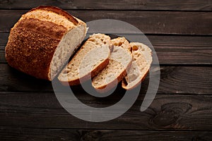 Homemade tartine bread on dark wooden table